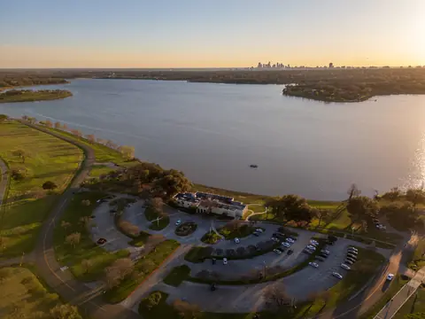 White Rock Lake in Dallas at sunset with the skyline far off